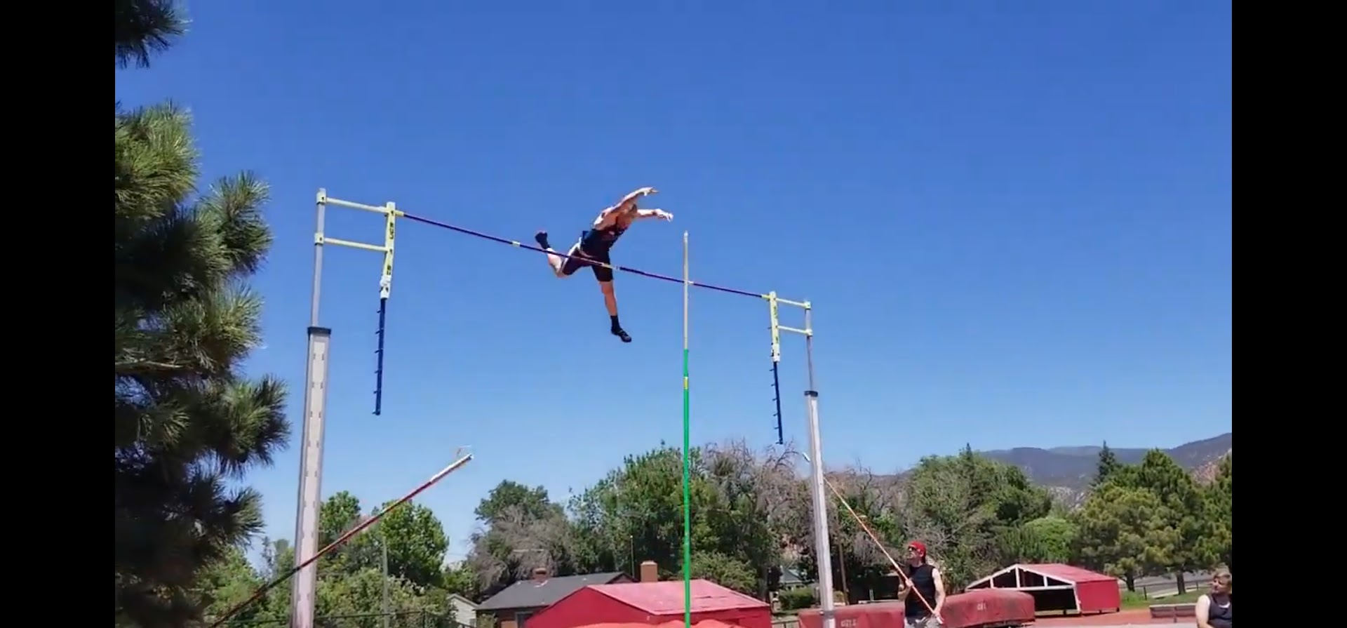 Coach Dillon Dopp pole vaulting